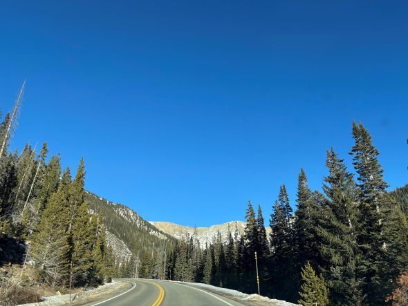 picture of a road in the mountains on a sunny clear day