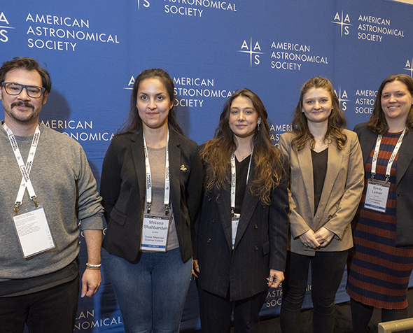 Researchers studying WR140 pose for a photo after a press conference.