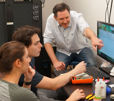 professor van engelenburg in lab with students