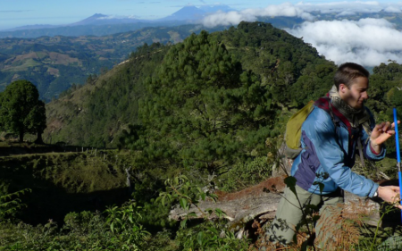 student coring tree in Guatemala