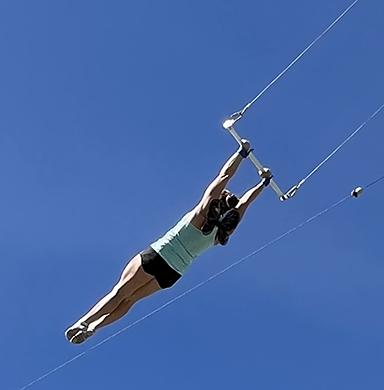 Mandi Schaeffer Fry performs a trick on the trapeze.